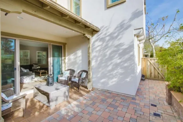 a bedroom with a bed flat screen tv and a window