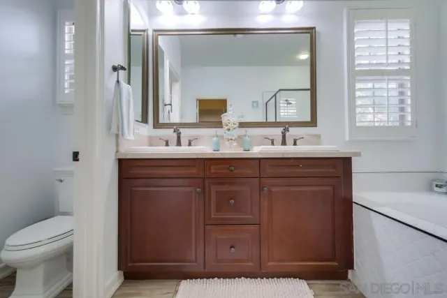 a bedroom with furniture and a fireplace