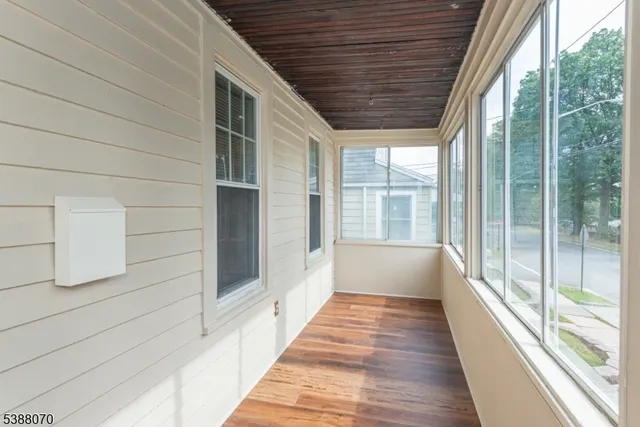 a view of balcony and wooden floor