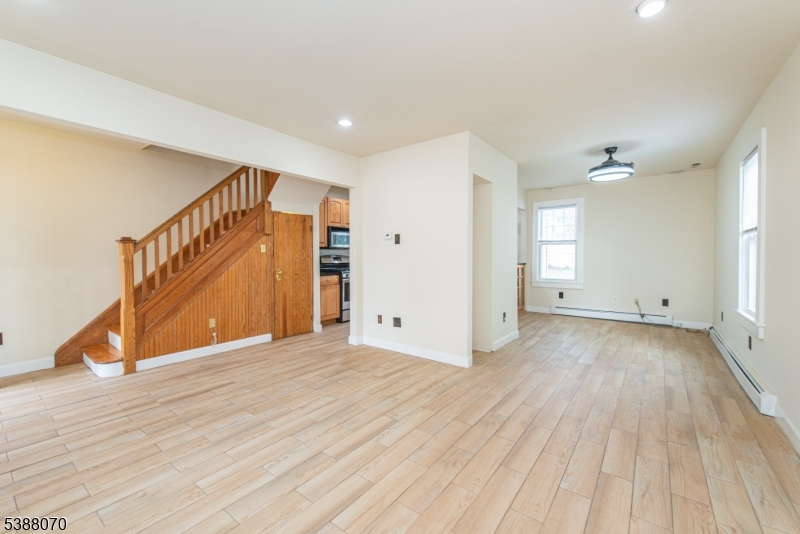 102 James Street Bloomfield, NJ 07003 - Photo 3 of 14 a view of an empty room with wooden floor