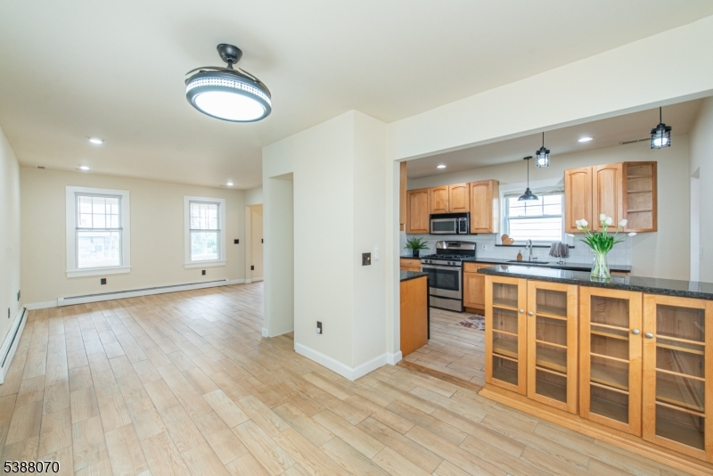 102 James Street Bloomfield, NJ 07003 - Photo 4 of 14 a view of a kitchen with wooden floor and windows