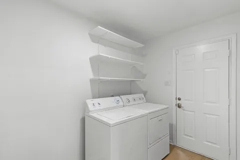 a utility room with dryer and washer