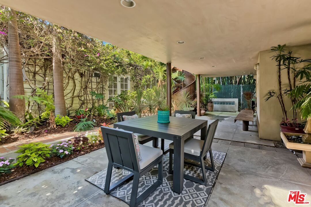 899 Commonwealth Avenue Venice, CA 90291 - Photo 33 of 47 a view of a patio with table and chairs and potted plants