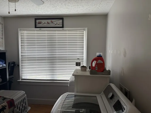 a bathroom with a sink and a window