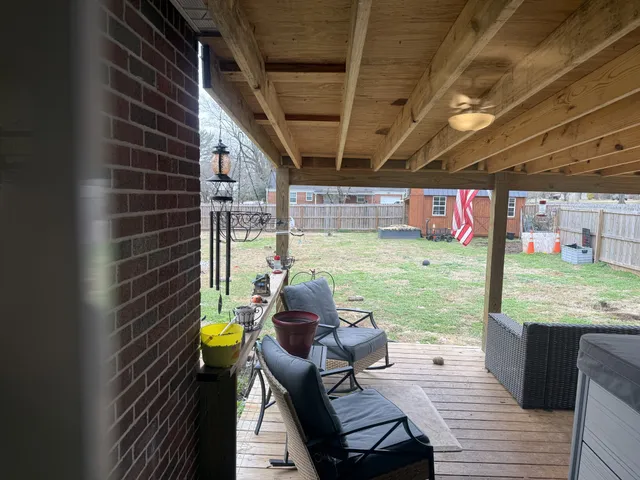 a view of a porch with furniture