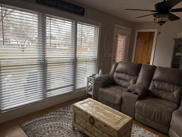 a living room with furniture and a window
