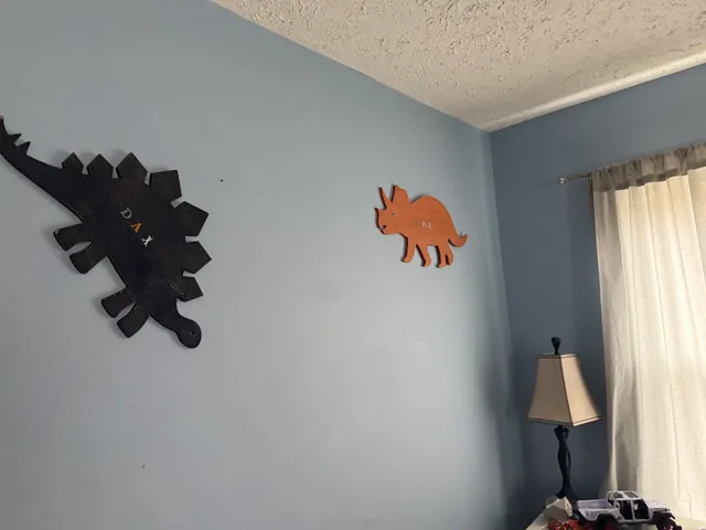 a room with a window and a chandelier