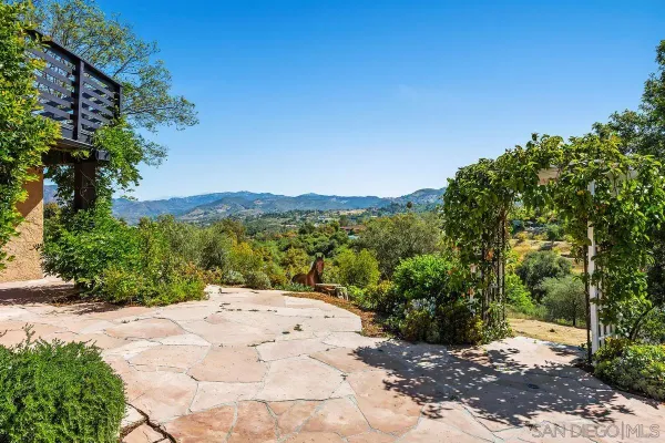 a view of a pathway with a yard