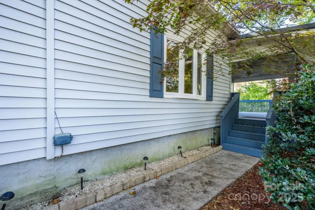 a view of a patio with table and chairs and wooden floor