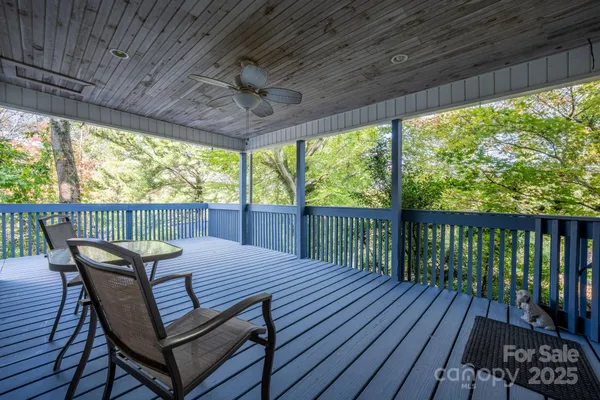 a view of a wooden deck with furniture