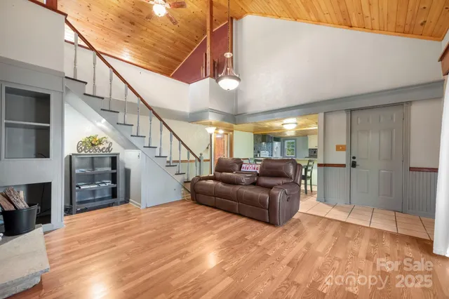 a kitchen with cabinets and chairs