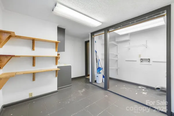 a view of walk in closet with window