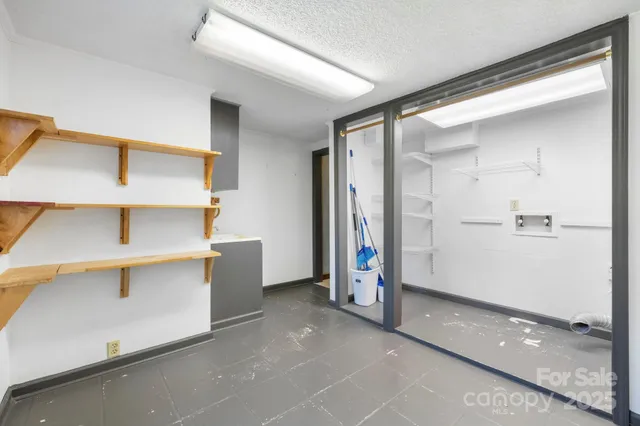 a lobby with furniture and a table