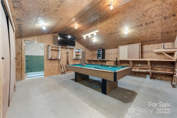 a lobby with furniture and a table