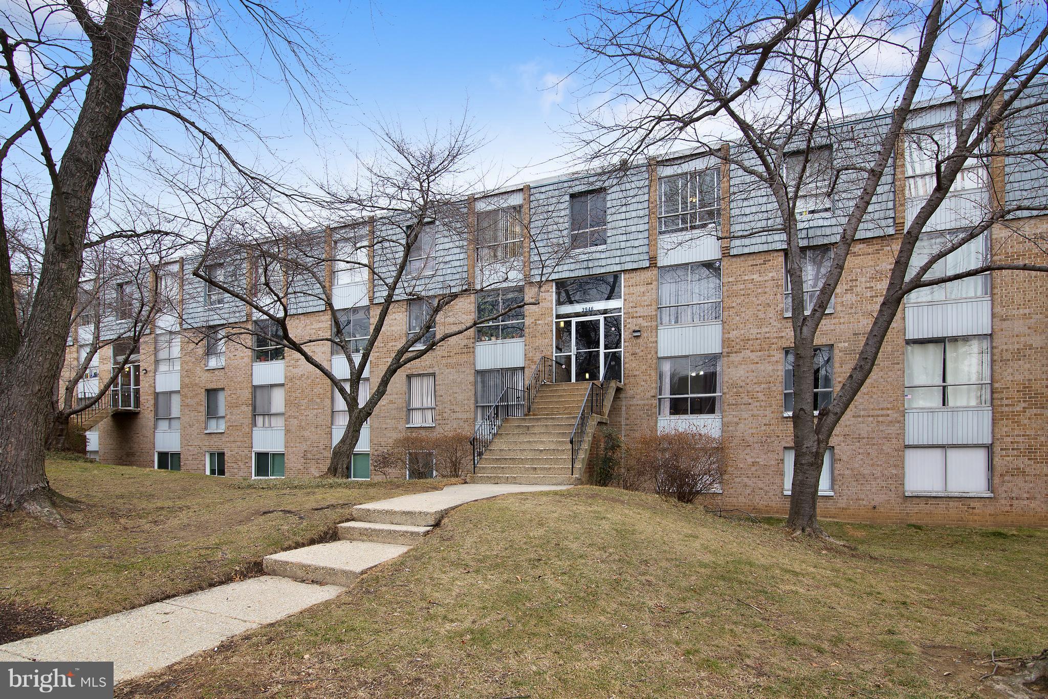 3946 Bel Pre Road, Unit 4 Silver Spring, MD 20906 - Photo 3 of 12 a view of a house with a yard