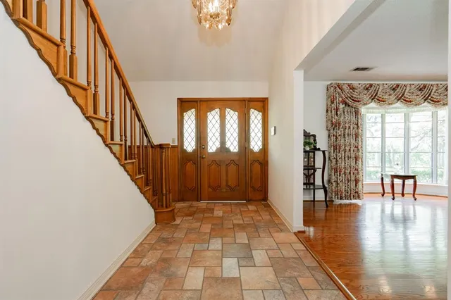 a view of a livingroom with furniture and a window