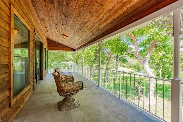 a green field with lots of trees