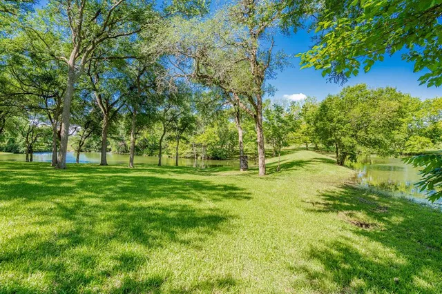 a view of a lake with a big yard
