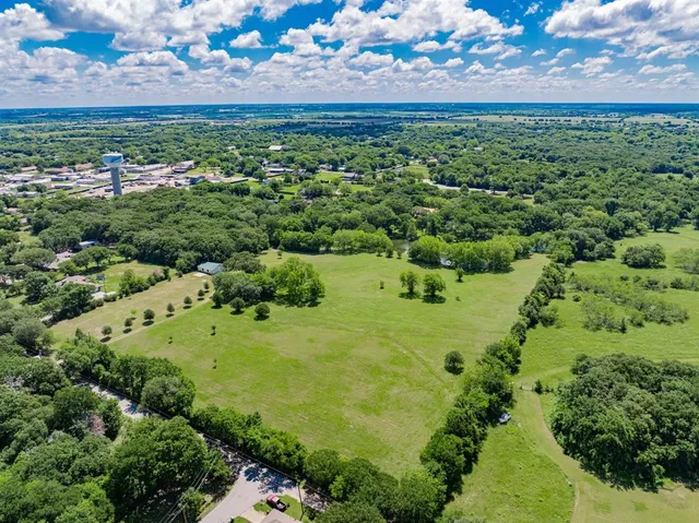 a view of a garden with an ocean