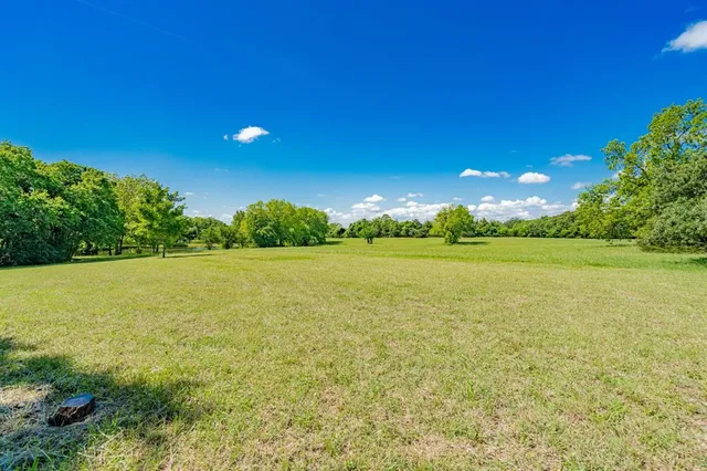 a view of an ocean and a yard