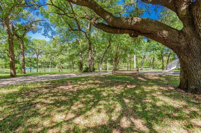 a house with swimming pool in front of it