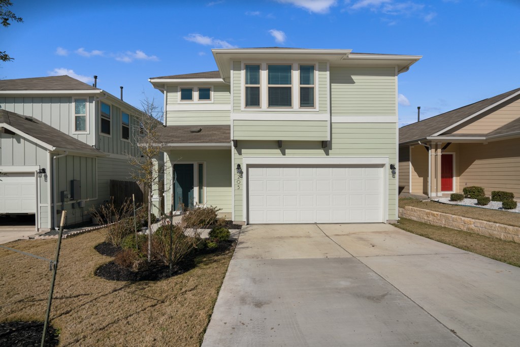 205 Guemal Road Buda, TX 78610 - Photo 1 of 33 a view of a house with more windows and potted plants