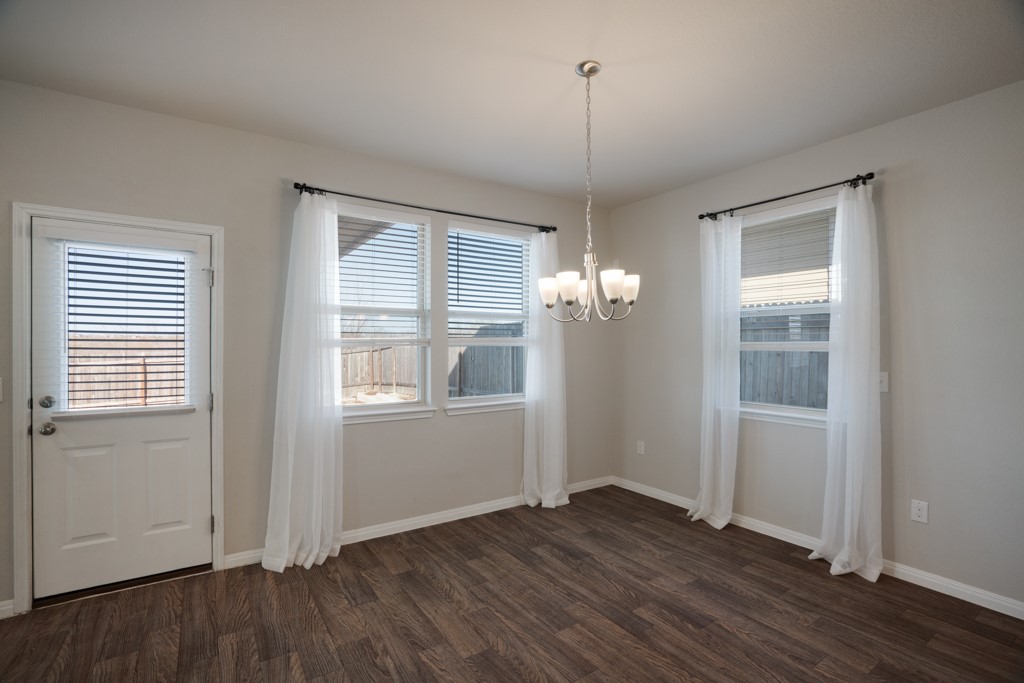 205 Guemal Road Buda, TX 78610 - Photo 12 of 33 a view of empty room with wooden floor and fan