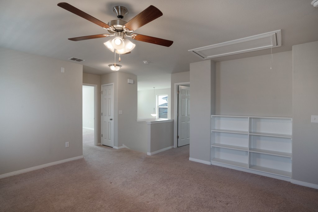 205 Guemal Road Buda, TX 78610 - Photo 16 of 33 a view of an empty room with a window