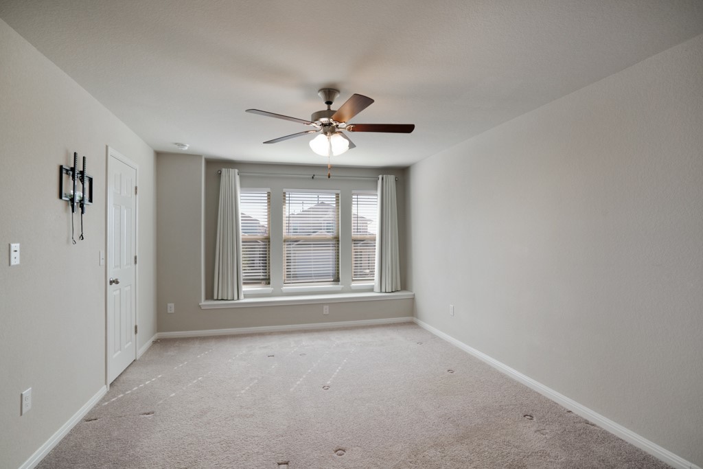 205 Guemal Road Buda, TX 78610 - Photo 18 of 33 a view of an empty room with a window