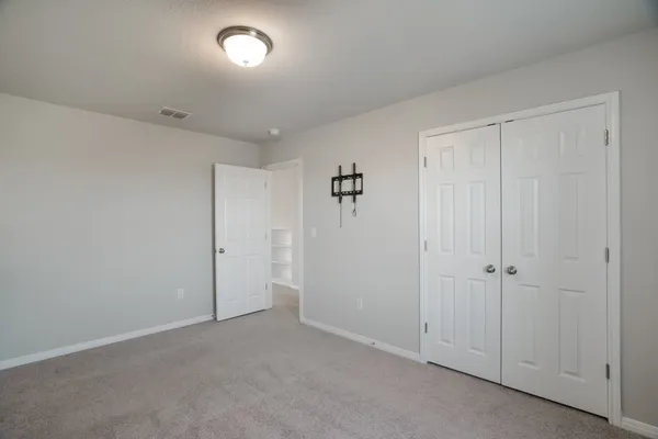 an empty room with a empty space and windows