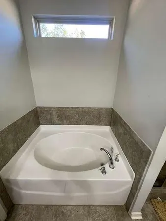 a bath tub sitting in a bathroom