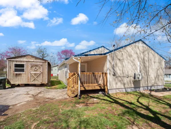 a view of a house with wooden fence
