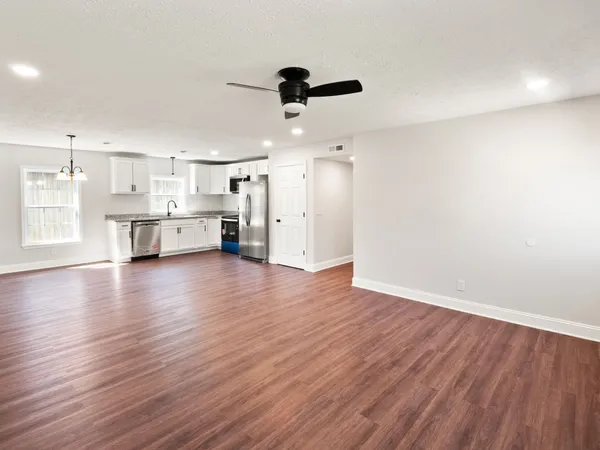 a view of a kitchen with a sink and a window
