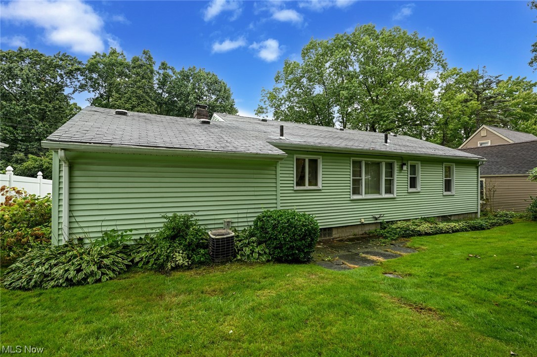 849 Bears Den Road Youngstown, OH 44511 - Photo 28 of 28 View of side of home with a yard and central AC unit