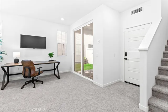 a workspace with furniture and a window