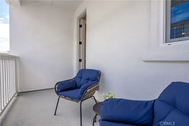 a living room with furniture and a chair