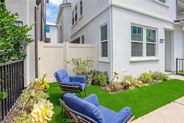 a view of a house with a backyard and porch