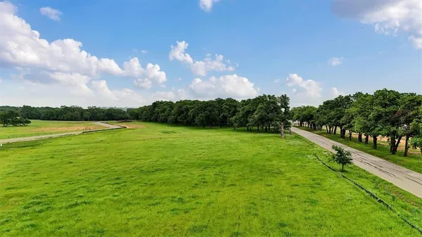 a view of a golf course with a lake
