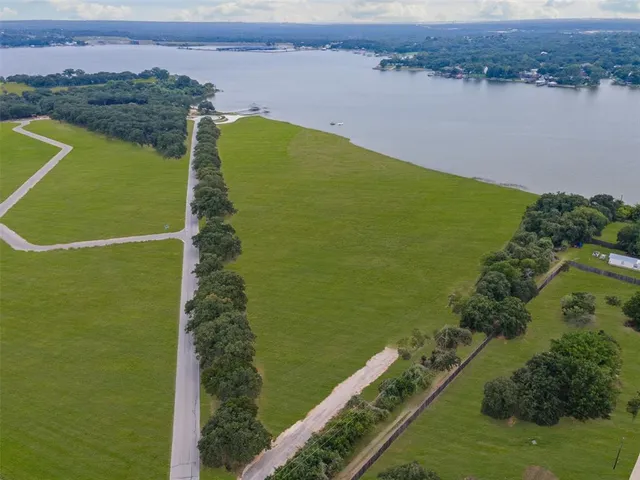 a view of a lake with a yard