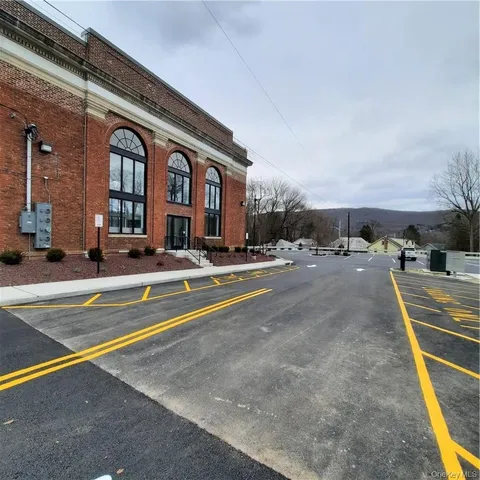 a view of swimming pool with outdoor seating
