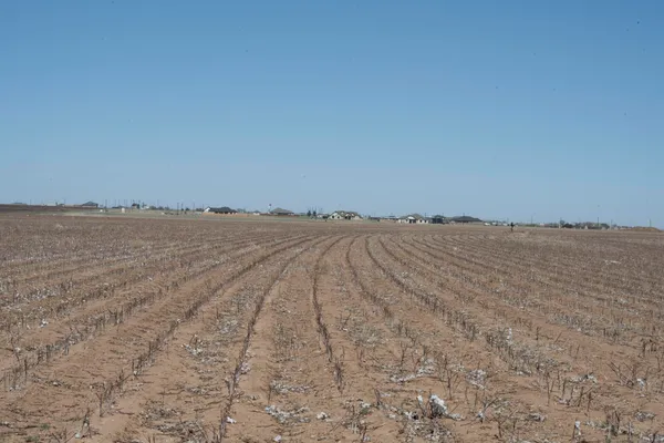 a view of an ocean beach and mountain