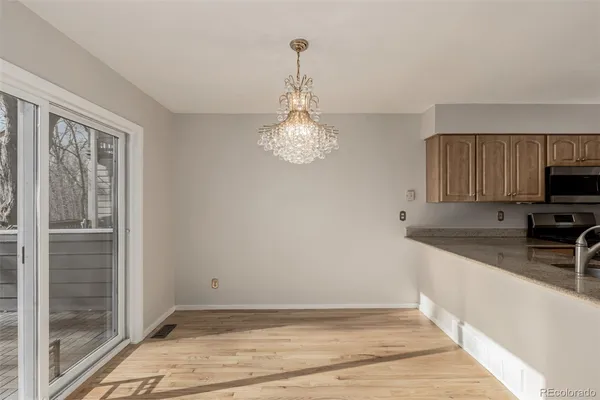 a view of a kitchen from the hallway