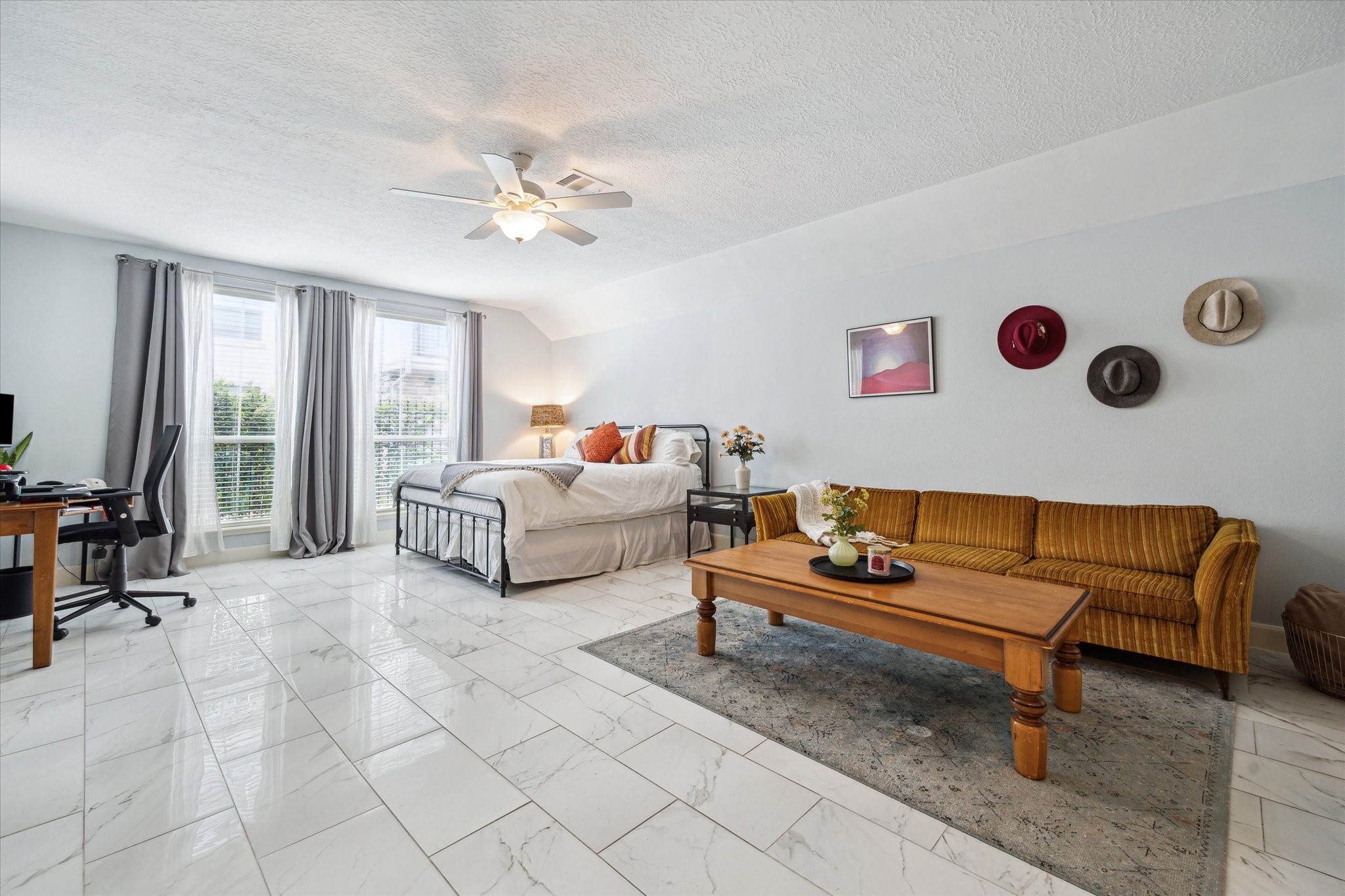 1310 Cohn Street Houston, TX 77007 - Photo 3 of 25 The first floor offers tons of flexibility with a spacious third bedroom suite and full bath, plus a bonus room ideal for a home gym, office, or fourth bedroom.