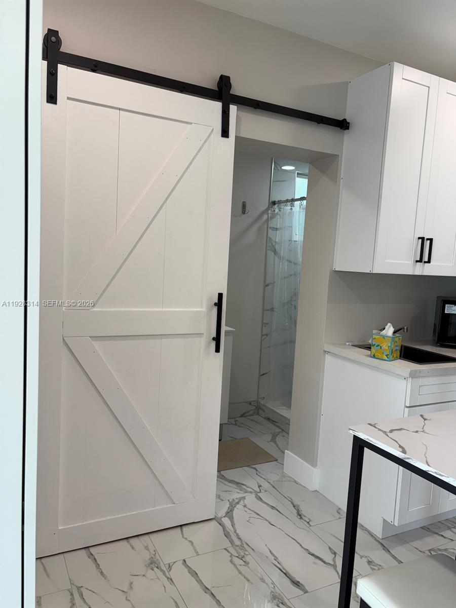 3360 Southwest 24th Terrace, Unit 3362B Miami, FL 33145 - Photo 15 of 15 a bathroom with a shower and a sink