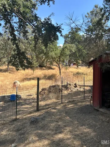 a view of a backyard of the house
