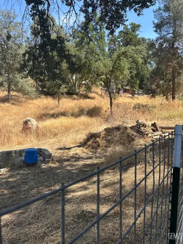 a view of a yard from a balcony