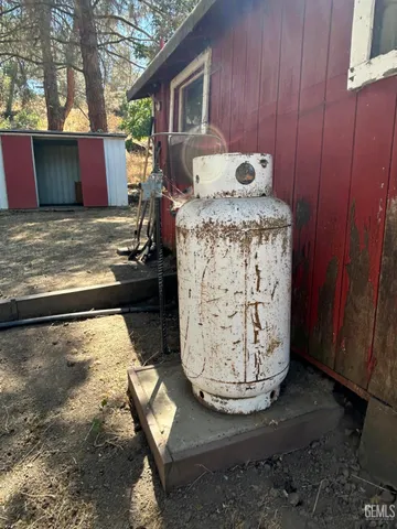 a backyard of a house with a tree