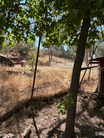 a view of house with backyard