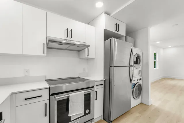a bathroom with a sink a toilet and bathtub