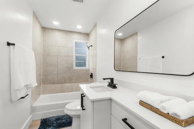 a bathroom with a bathtub and shower